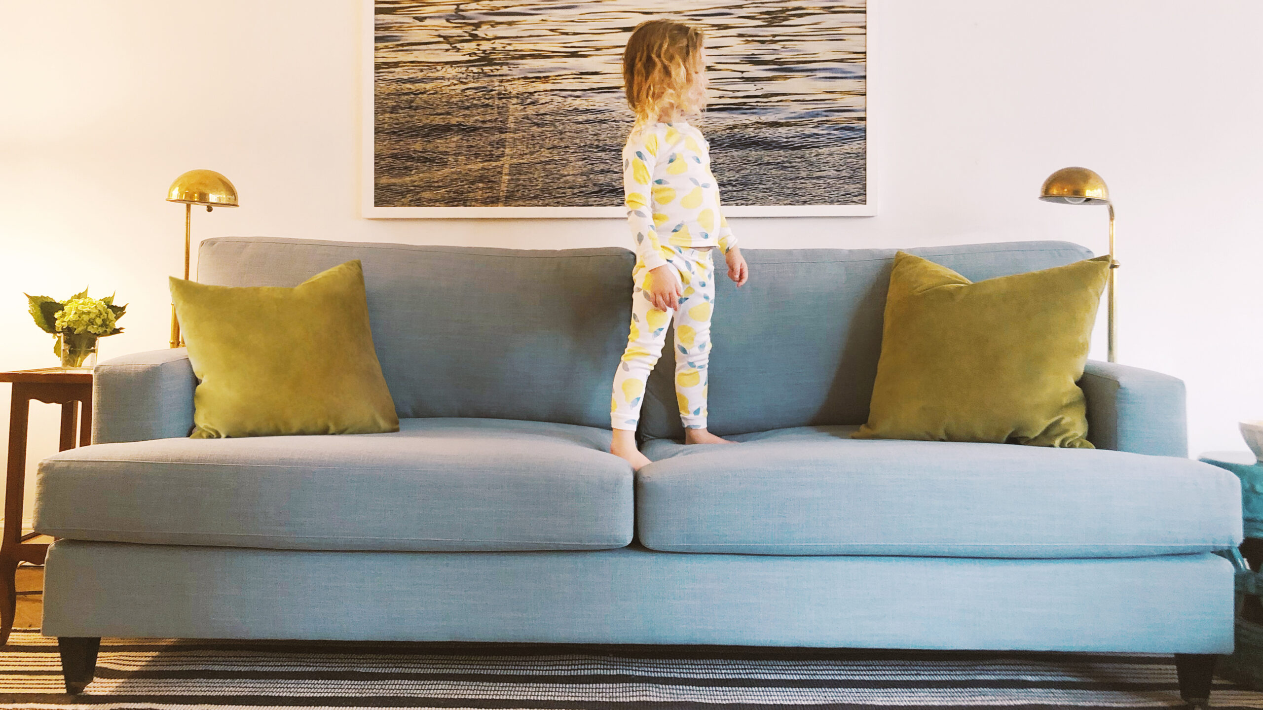 Classic sofa in a living room with a child on the sofa