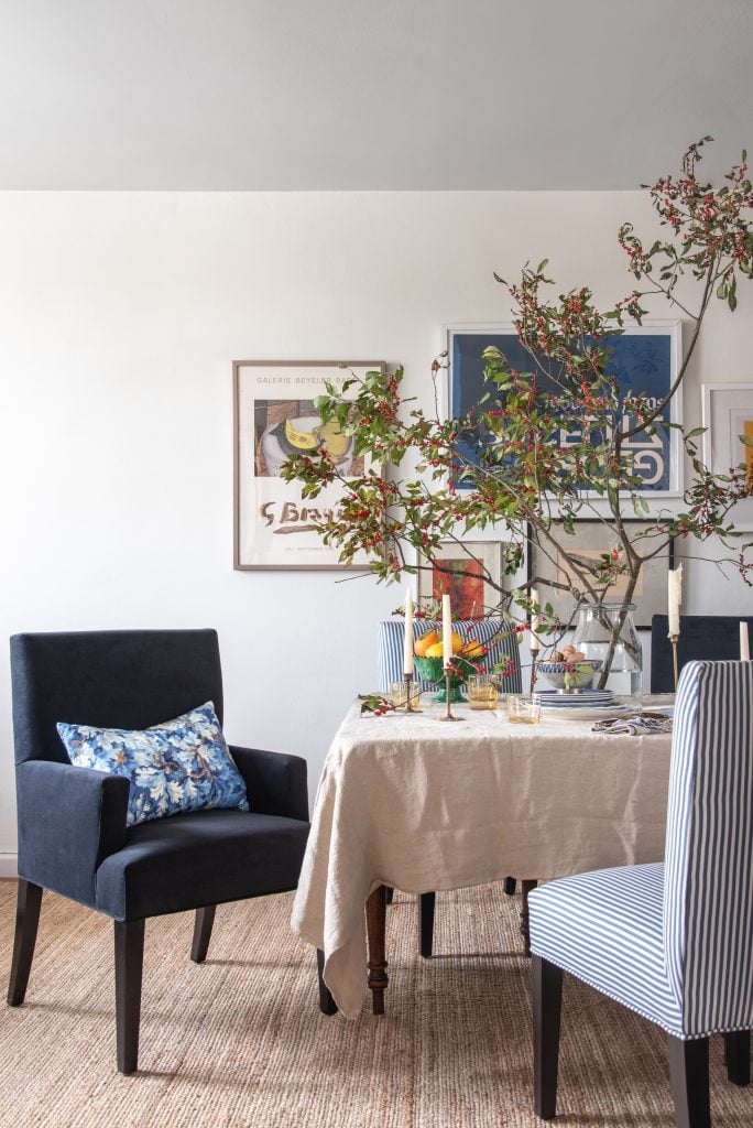 Custom Upholstered Dining Chairs in Navy Velvet with a Lumbar Pillow in Verdure Bois de Chene by OWW