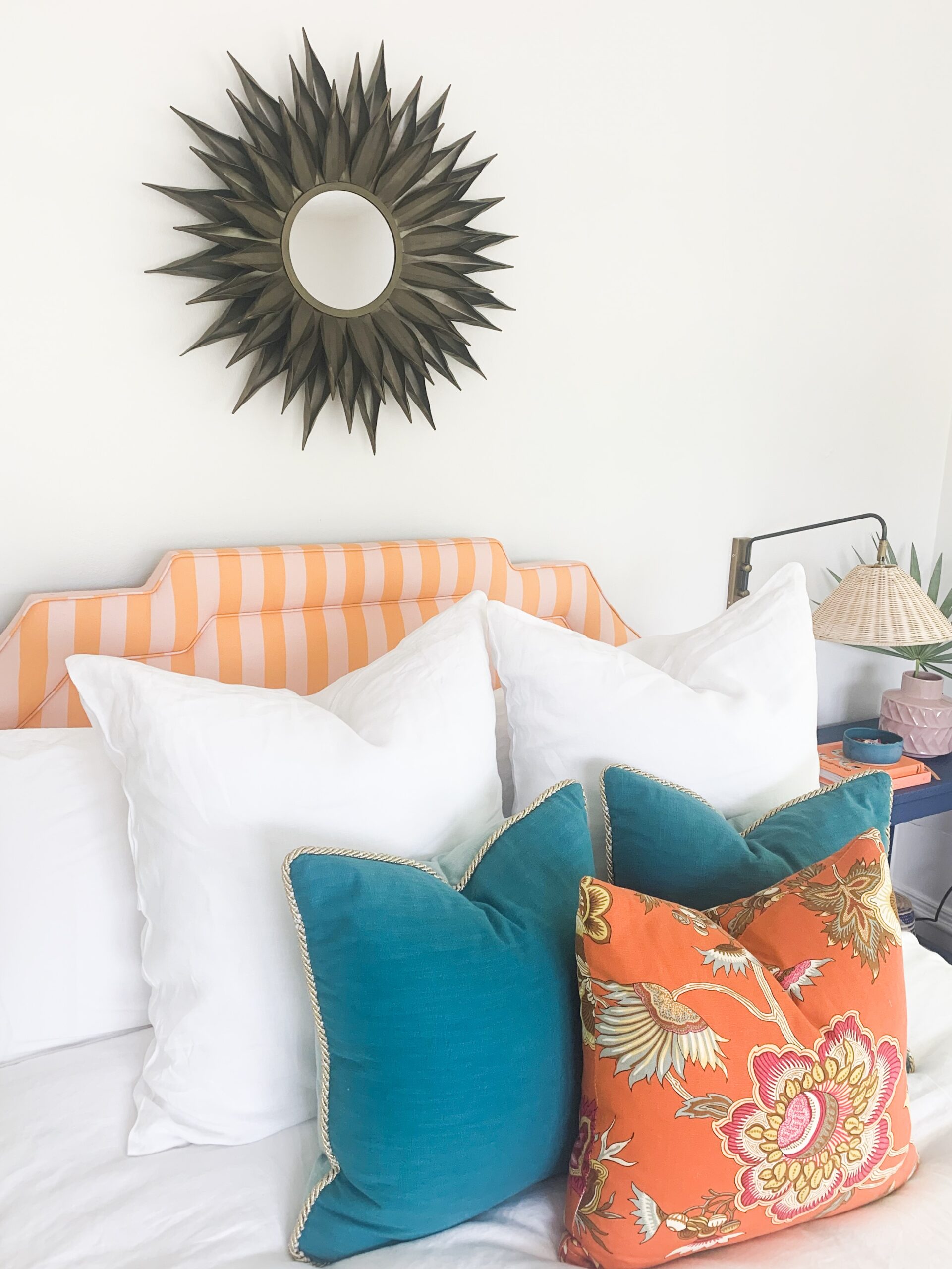 An Art Deco interior design bedroom with geometric patterns and bold  colors. The walls are painted