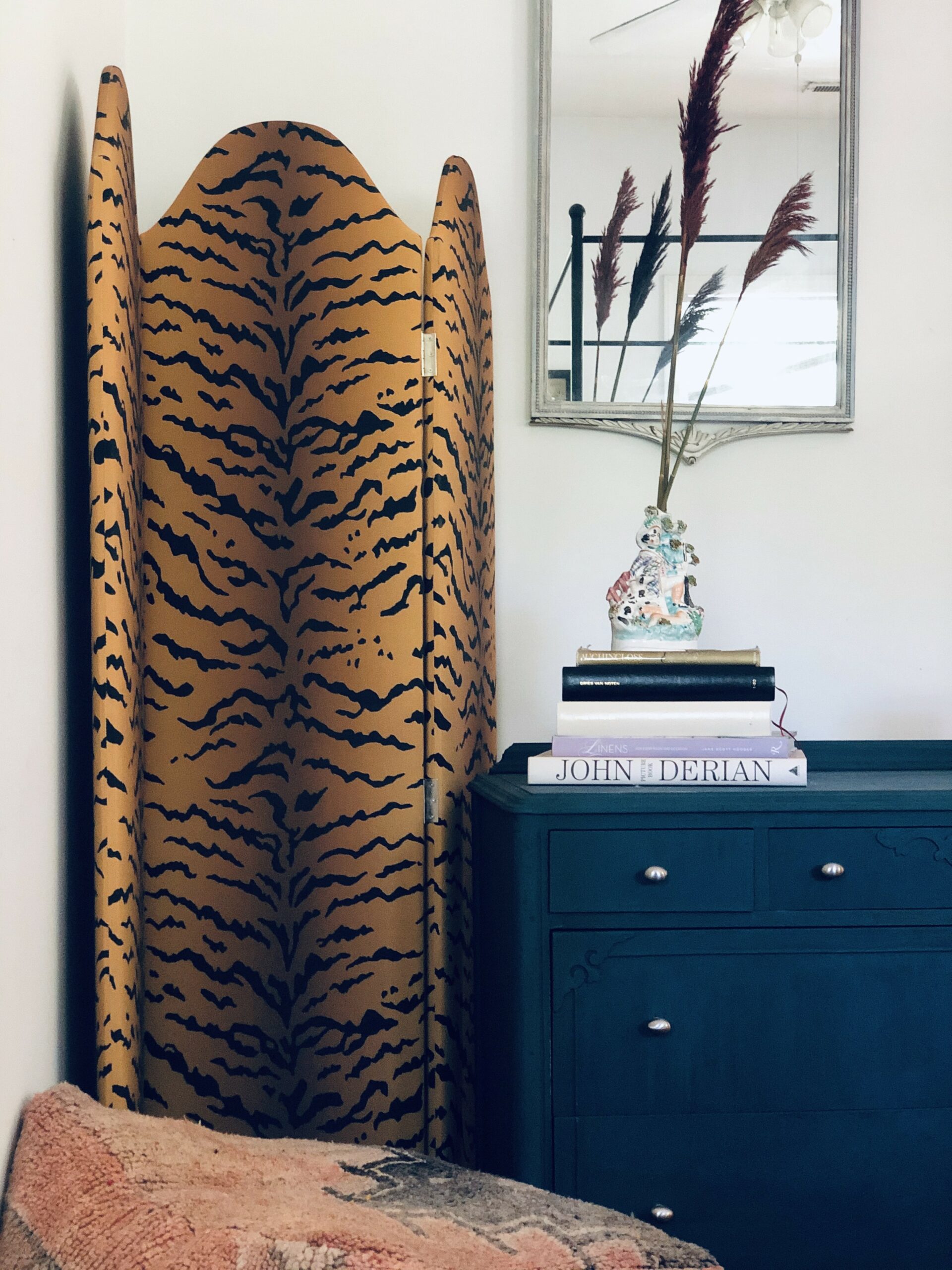 An Art Deco interior design bedroom with geometric patterns and bold  colors. The walls are painted